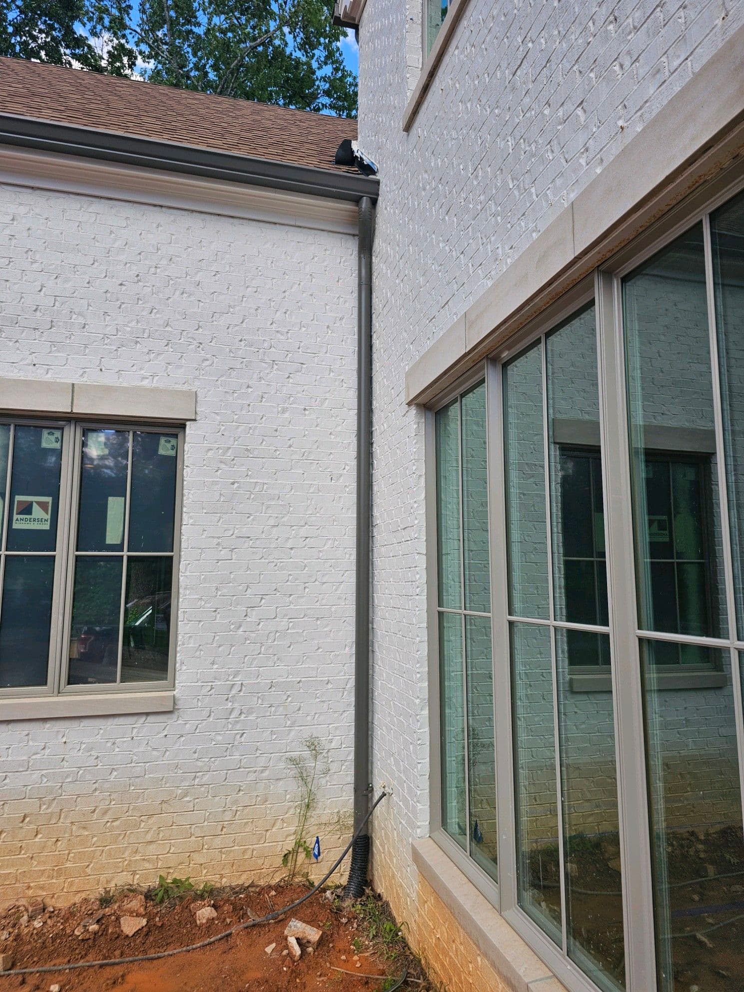 New Gutters with Round Downspouts Installed in Sandy Springs image