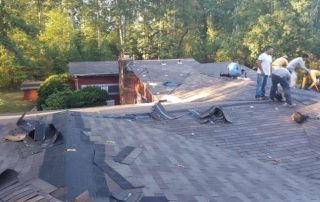 Griffin Roofing in Atlanta, GA - roofers are repairing a roof