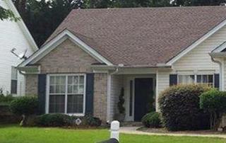 Griffin Roofing in Atlanta, GA - A picture of a house with a shingle roof