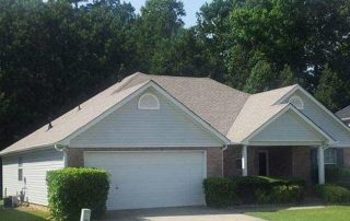 Griffin Roofing in Atlanta, GA - a picture of a house with a newly installed roof